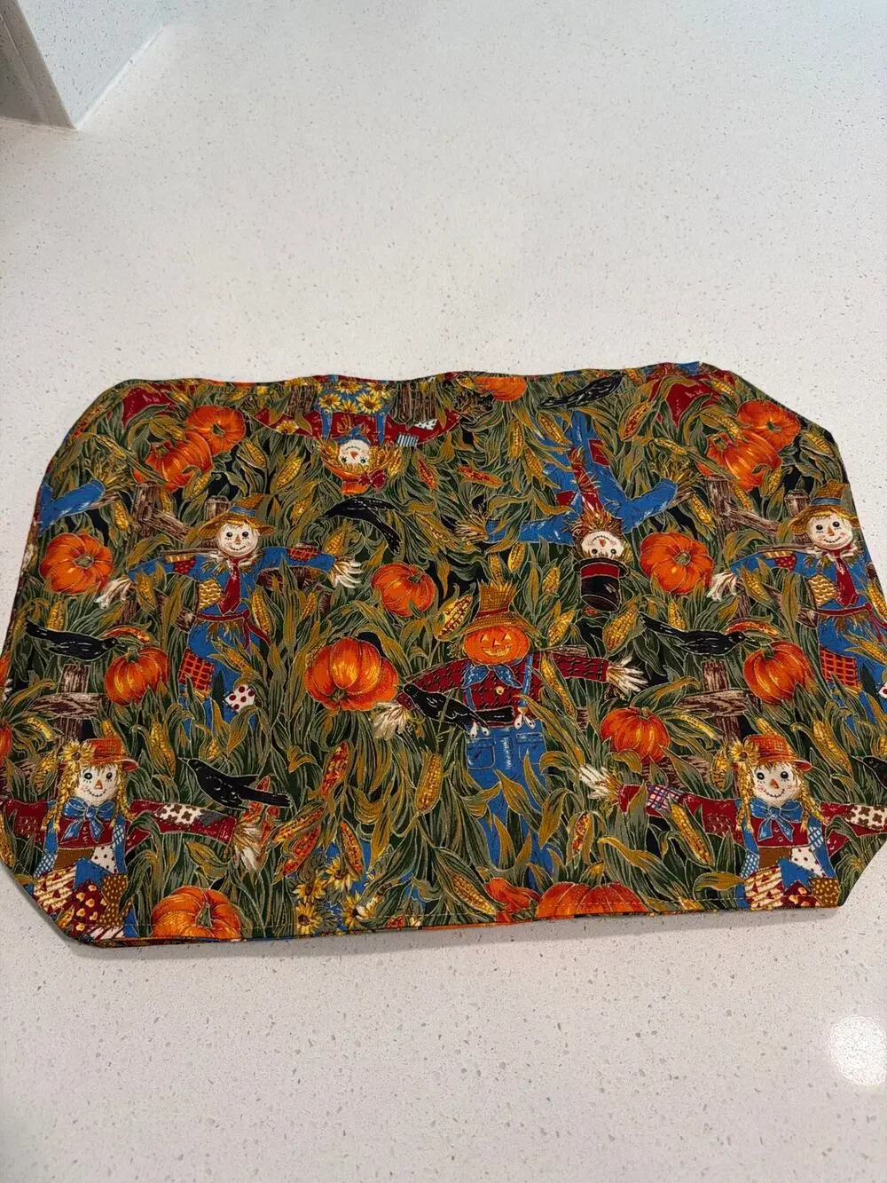 4 fall placemats with scarecrows, pumpkins, crows and cornstalks